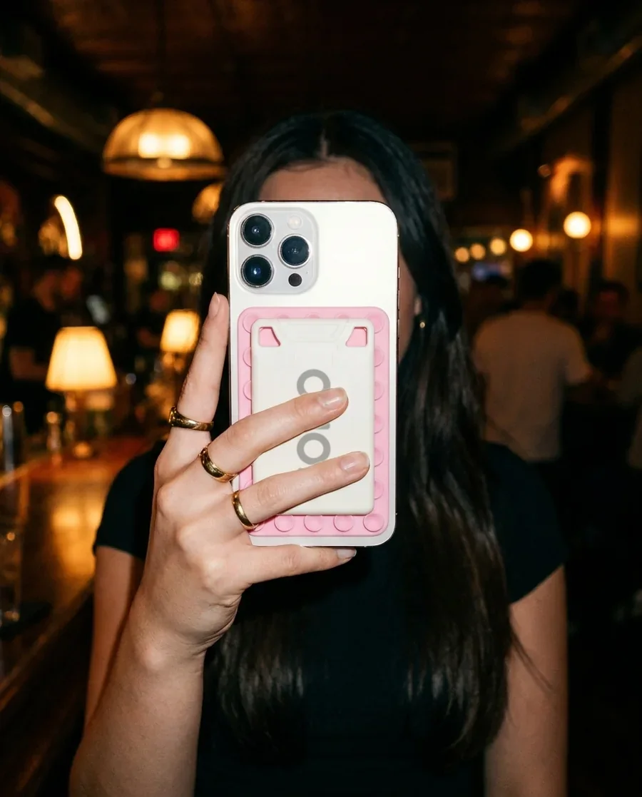 The white VORO card stuck to a pink Octobuddy pad on the back of a phone.